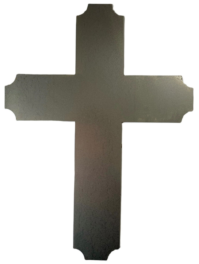 A Silhouette of a cross made out of mild steel makes an ideal backdrop to a large candle
