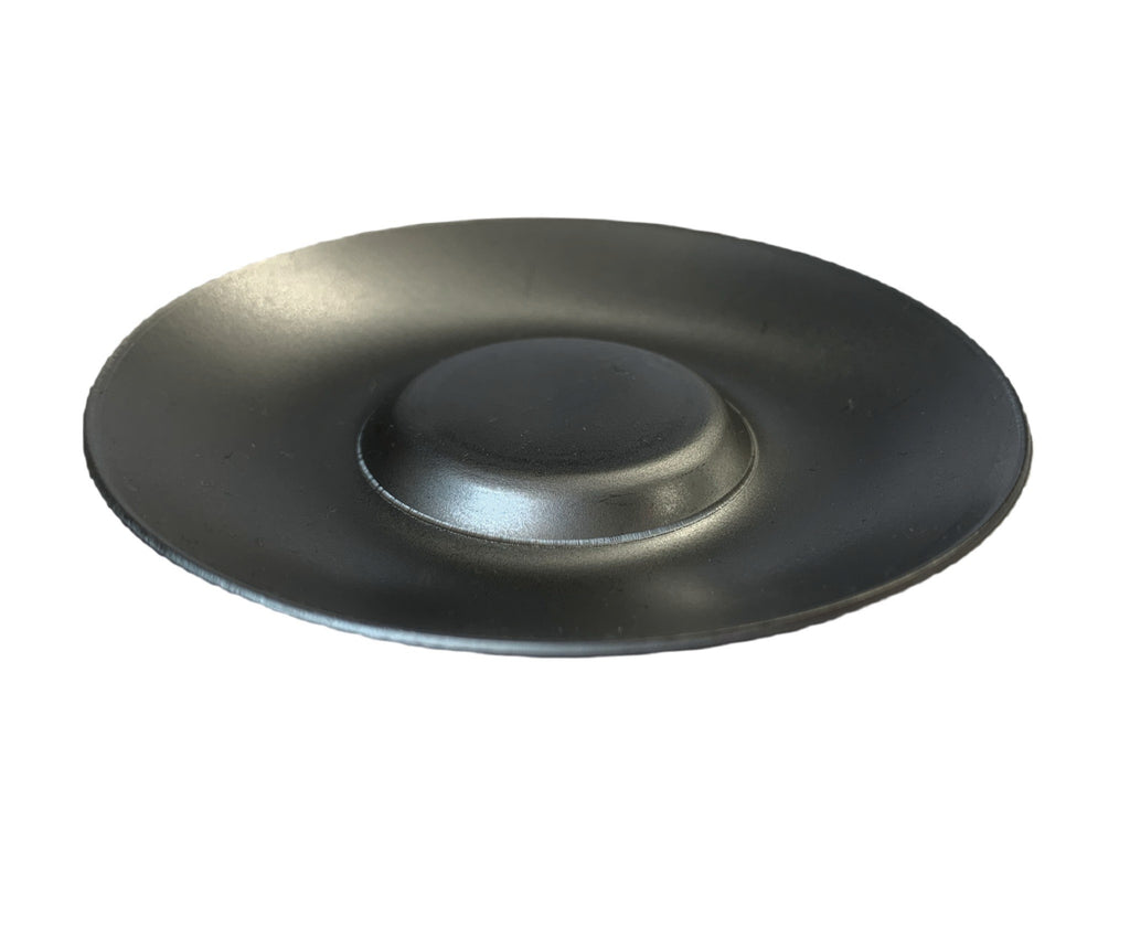 This indented candle tray holder has a smooth plain metal finish 